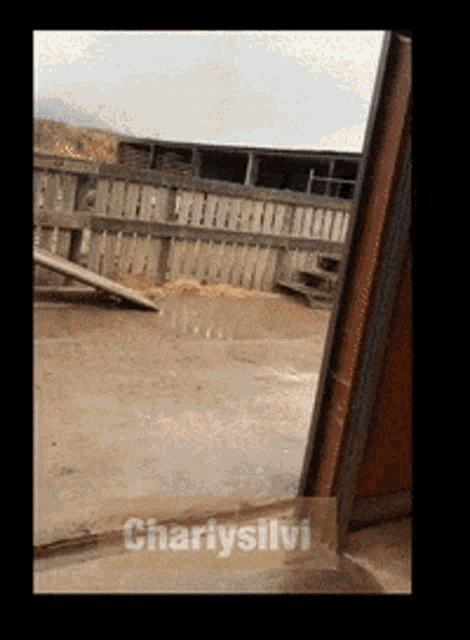 a picture of a fence with the name charitysilvi on the bottom right