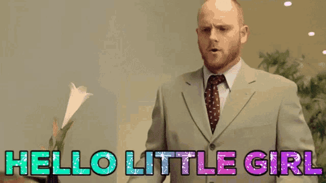 a man in a suit and tie with the words hello little girl behind him