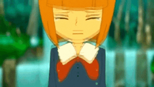a cartoon girl with orange hair is crying with her eyes closed and her hands on her chest .