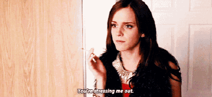 a woman is standing in front of a door talking to someone .