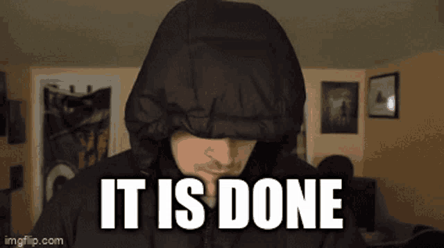 a man wearing a hooded jacket with the words it is done on the bottom
