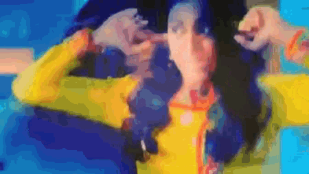 a colorful painting of a person making a face