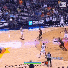 a basketball game is being played on a court sponsored by pacific office automation