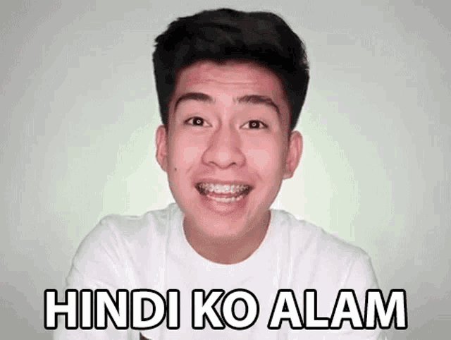 a young man with braces on his teeth is smiling and says hindi ko alam .