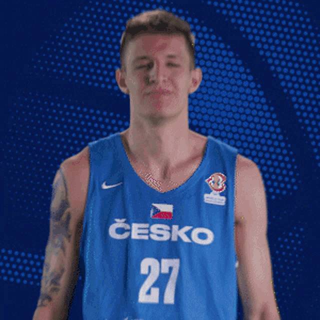 a man in a blue jersey that says ' czecho sport ' on it