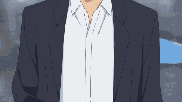 a man in a suit and white shirt has a white collar