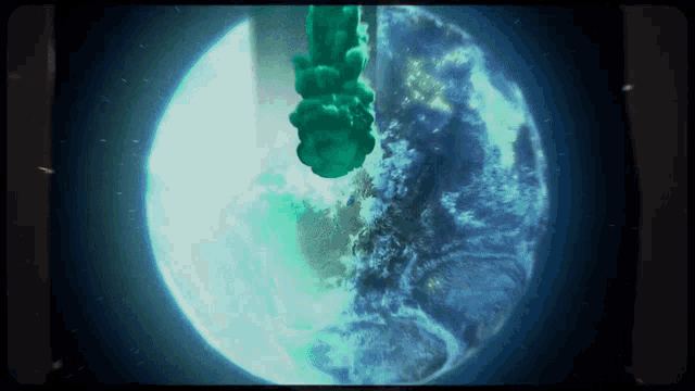 a green smoke coming out of the earth 's atmosphere
