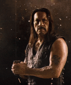 a man with long hair is holding a blue object in his hands