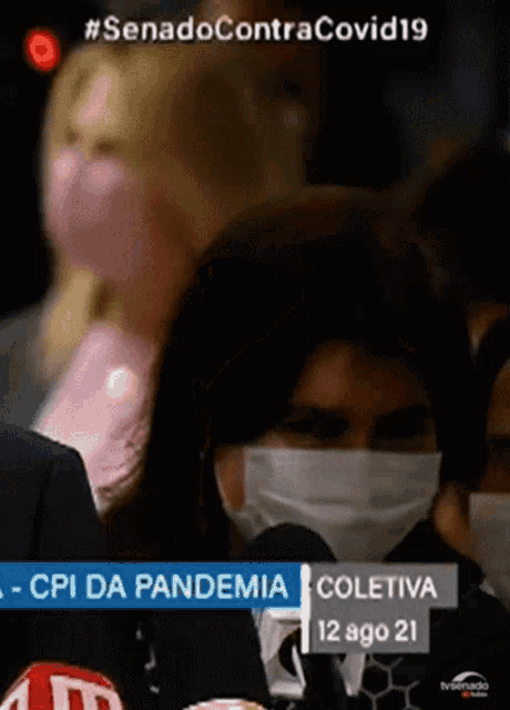 a group of people wearing face masks with the date 12 ago 21 on the bottom right