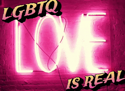 a neon sign that says " love is real "