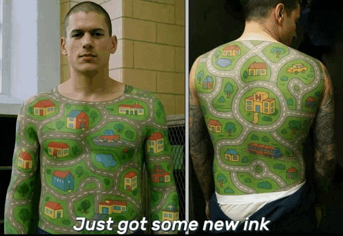 a picture of a man 's back with houses and roads and the words just got some new ink