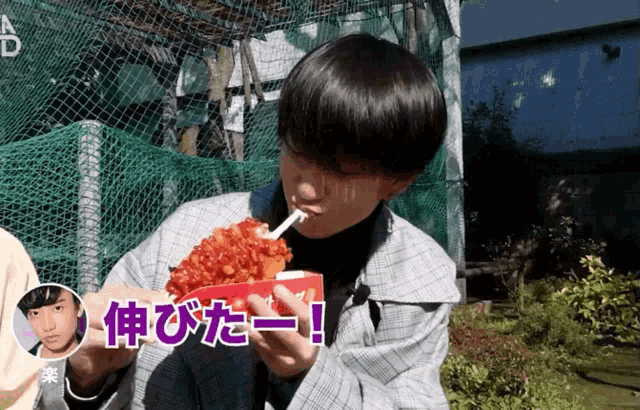 a man is eating a large amount of food with chinese writing on the bottom of his face