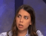 a close up of a woman making a funny face
