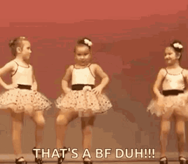 two little girls are dancing on a stage and one of them is saying `` that 's a bf duh !! ''
