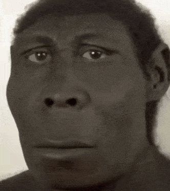 a black and white photo of a man 's face