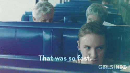 a woman wearing ear buds is sitting on a bus with the words that was so fast behind her