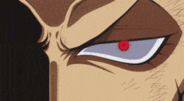 a close up of a cartoon character 's eye with a red pupil