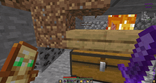 a screenshot of a minecraft game shows a purple sword and a chest