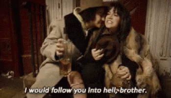 a man and a woman are sitting on a couch and the man is saying i would follow you into hell brother