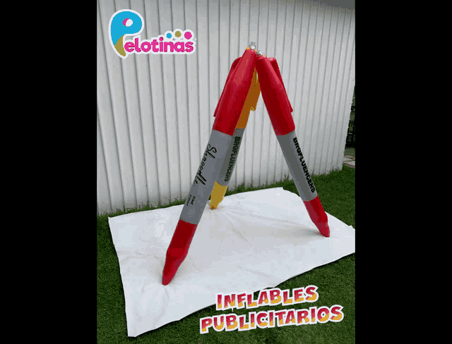an inflatable sharpie marker is sitting on a white sheet