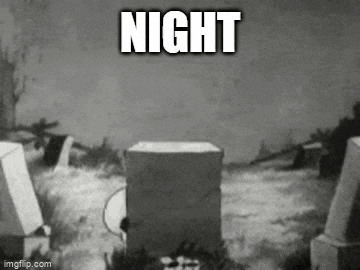a black and white photo of a cemetery with the words `` night '' written on the bottom of the photo .