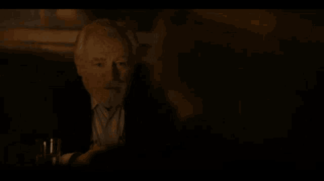 a man in a dark room with the words people pretending to be people