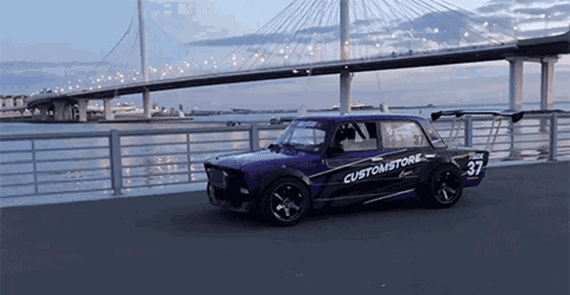 a purple car with customstore written on the side