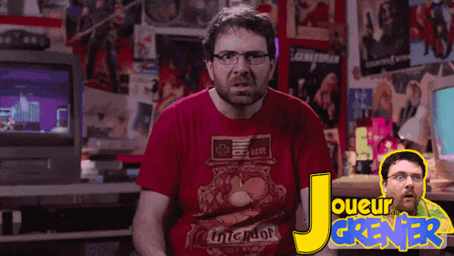 a man wearing a red shirt that says nintendo