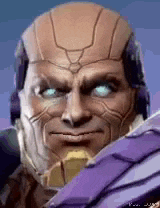 a close up of a man 's face with blue eyes and a helmet on .