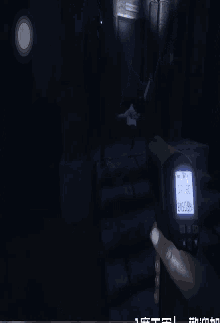 a person is holding a thermometer in a dark room and the temperature is 84 degrees celcius