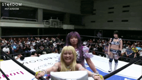 two women are in a wrestling ring with the word stardom on the bottom