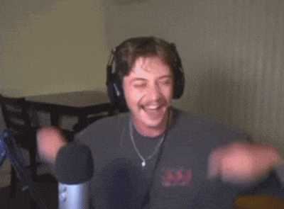 a man wearing headphones and a t-shirt with a skull on it