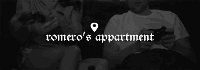 a black and white photo of romero 's apartment with two men