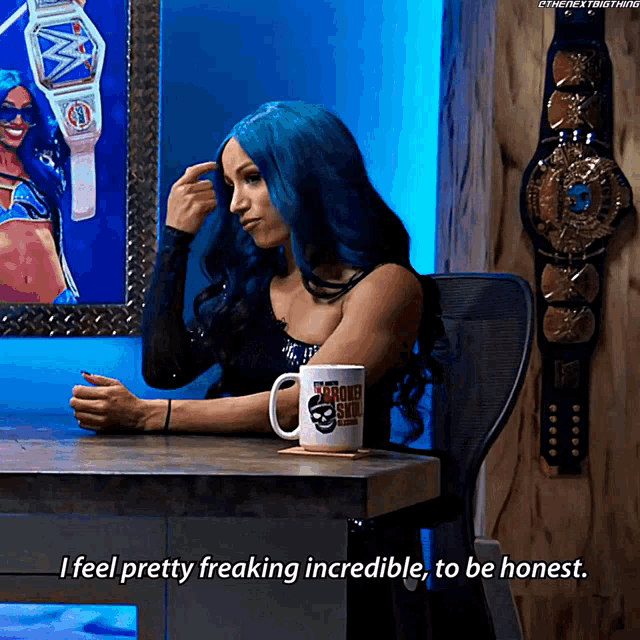 a woman with blue hair is sitting at a table with a mug that says i feel pretty freaking incredible