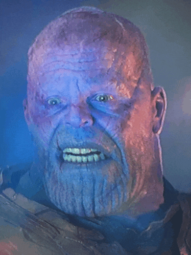 a close up of a man 's face with a beard and purple skin