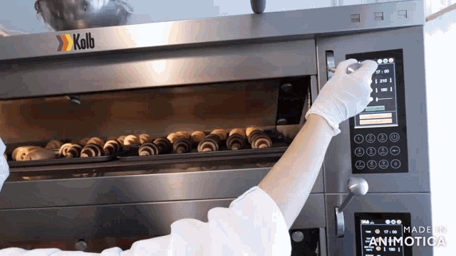 a kolb brand oven is being used to bake bread