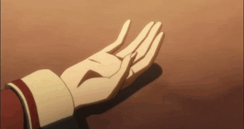 a close up of a person 's hand reaching out towards something
