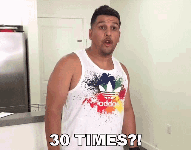 a man wearing a white adidas tank top is asking 30 times