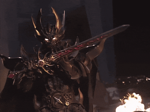 a person with a crown on their head is surrounded by red flames