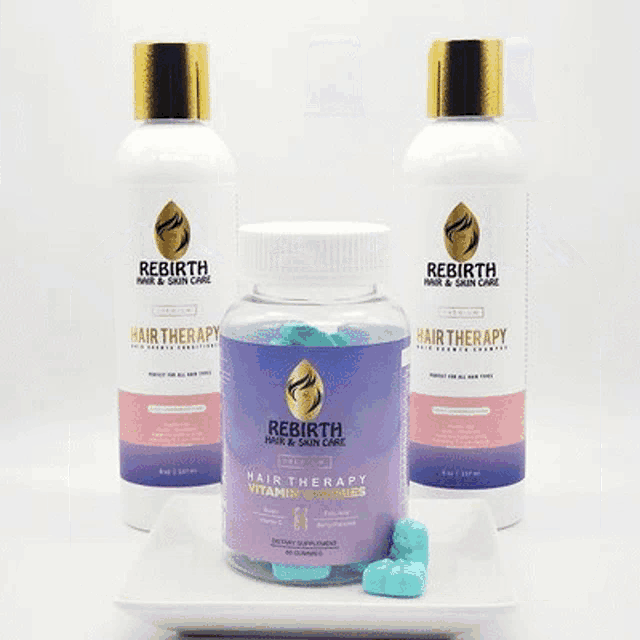 a bottle of hair therapy vitamins and a bottle of shampoo and conditioner are on a plate .