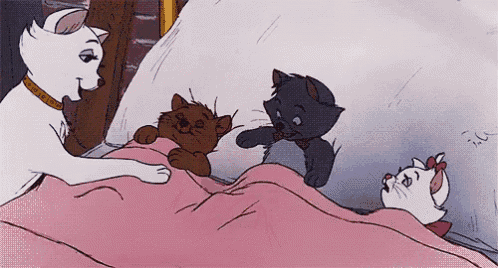 a cartoon cat is laying on a bed with three kittens