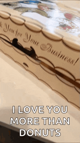a box of donuts that says i love you more than donuts
