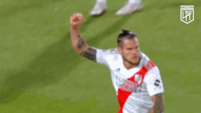 a soccer player with turkish airlines on his jersey