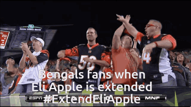 a group of bengals fans cheer on their team when eli apple is extended