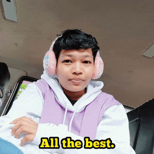 a man wearing ear muffs and a purple hoodie says " all the best "