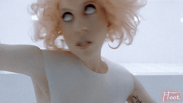 a close up of a woman 's face with the word float in the corner