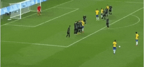 a soccer game is being played on a field with players in yellow and blue uniforms .