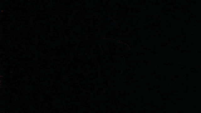 a man wearing sunglasses has a red light on his lens