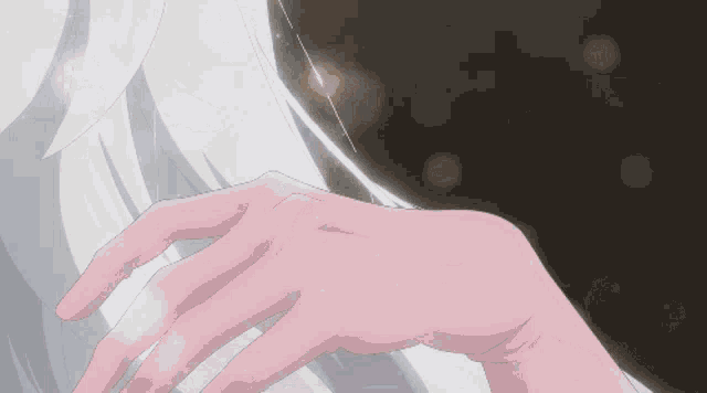 a close up of a person 's hand touching another person 's hand