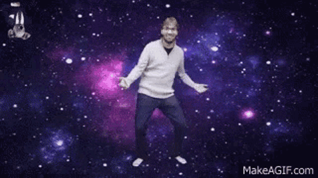 a man is dancing in the middle of a galaxy